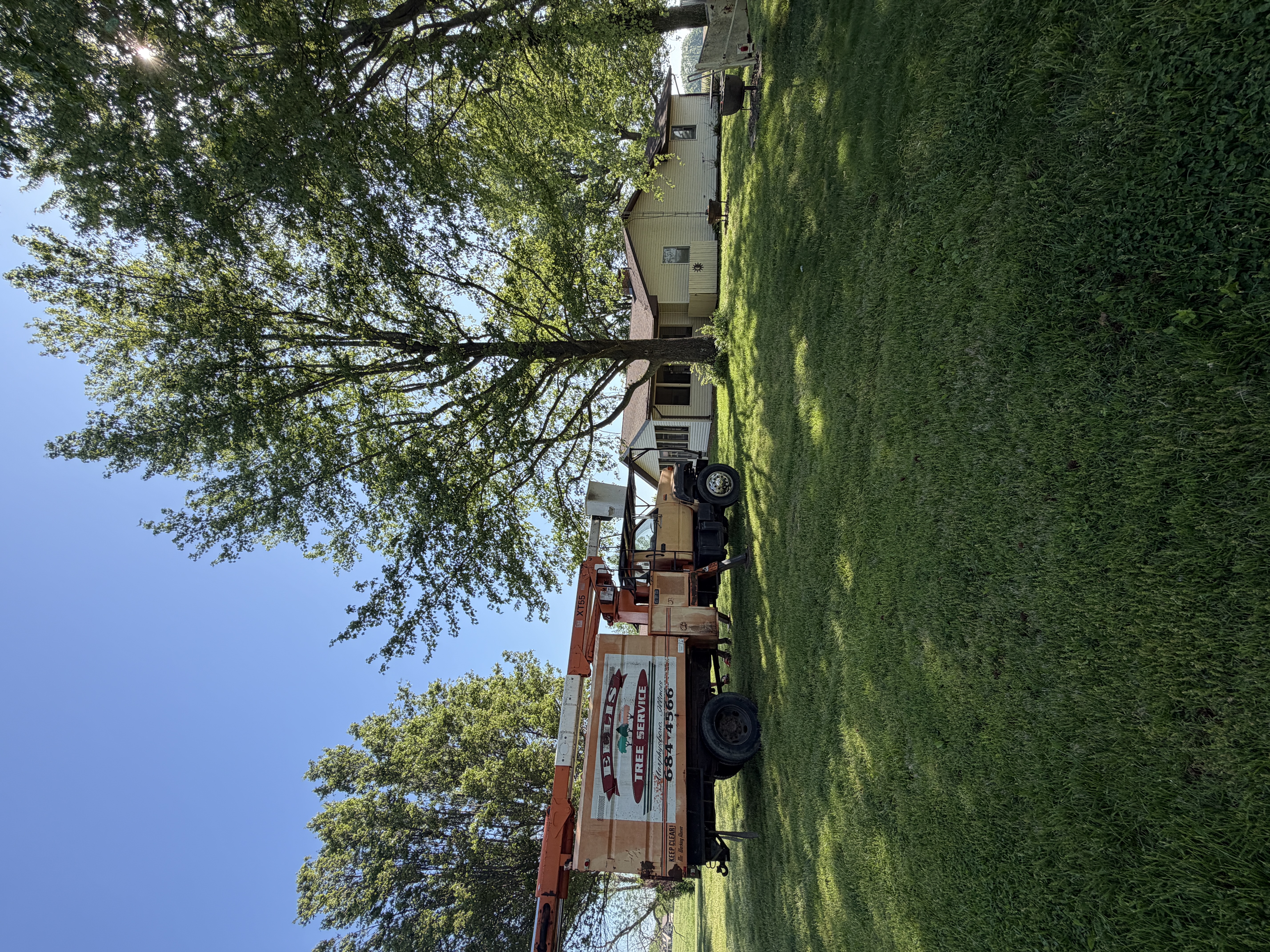 Ellis Tree Service bucket truck at job site Ava IL Southern Illinois